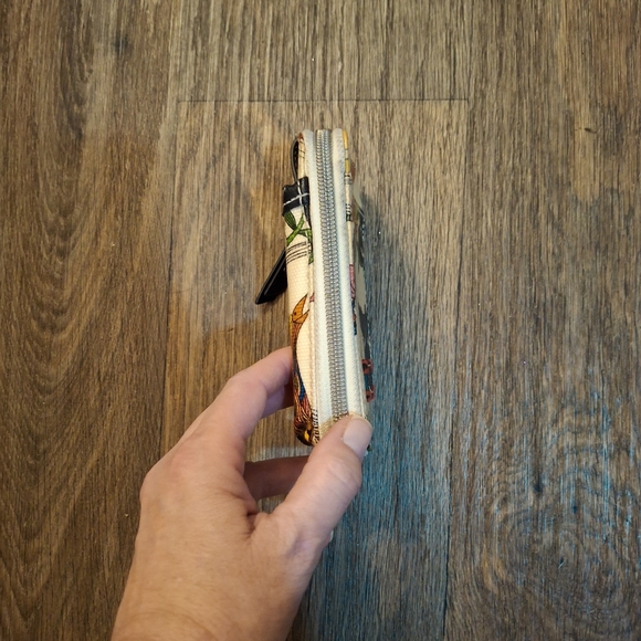 The Sakroots Peace Crossbody Wallet. - Picture 13 of 15